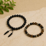 Black bead and tiger eye balance bracelets with tassel ties, beaded stretch style