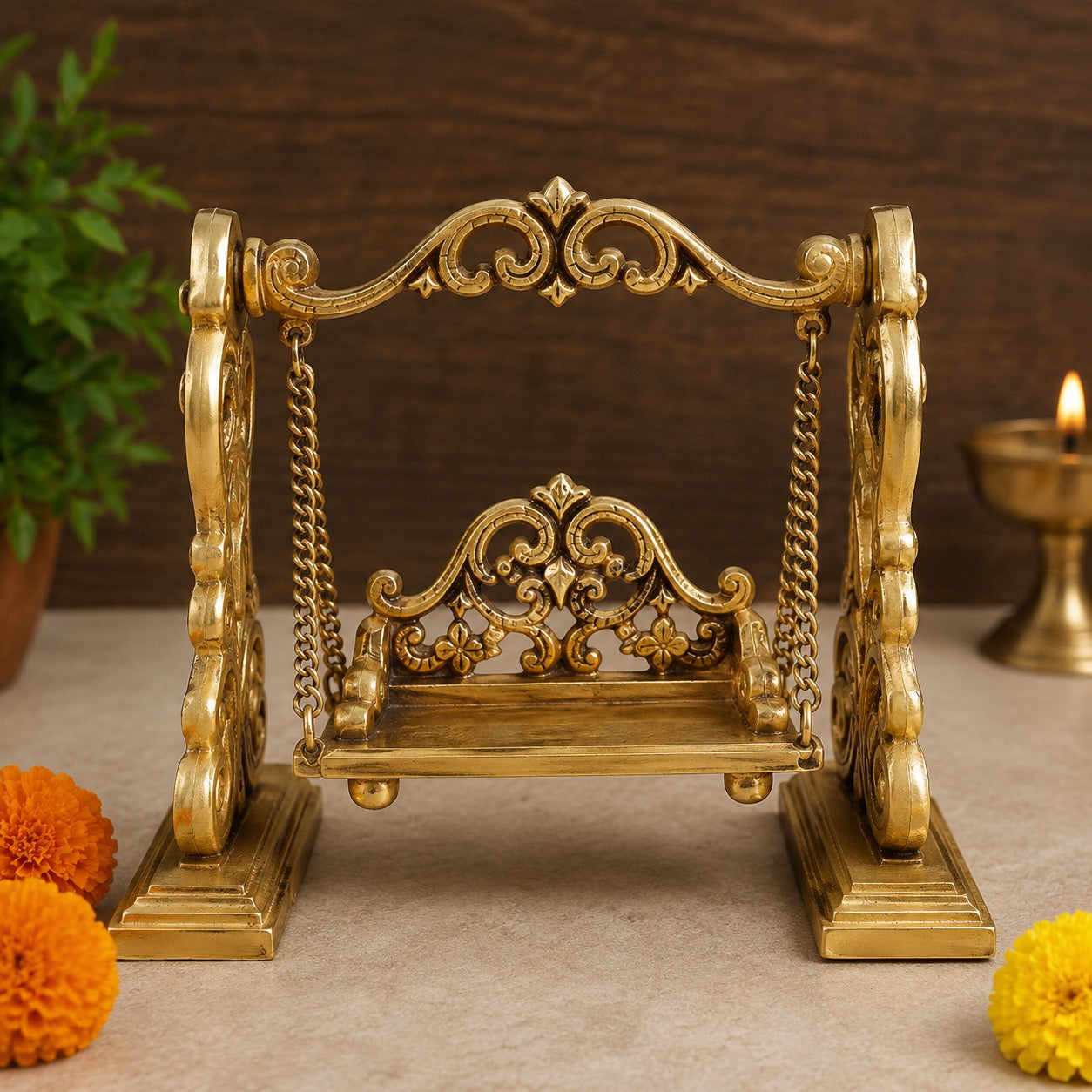 Ornate brass swing cradle with chains and carved back, traditional Laddu Gopal style
