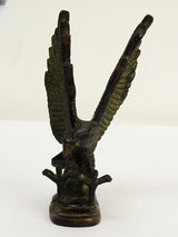Brass eagle sculpture figurine showing side profile and raised wing posture, 8 in