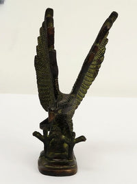 Brass eagle sculpture figurine showing side profile and raised wing posture, 8 in