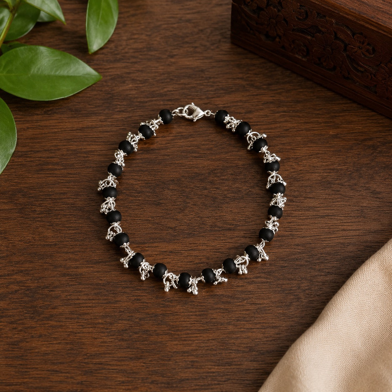 Karungali Beads Bracelet with Floral Silver Accents