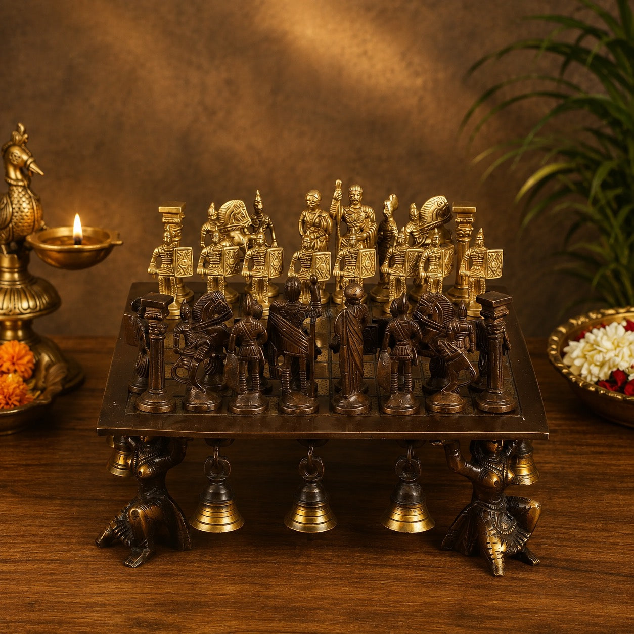 Antique brass chess set with ornate gold and dark pieces on a square board