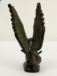 Brass eagle figurine viewed from rear, wings up with engraved feather texture, 8 in