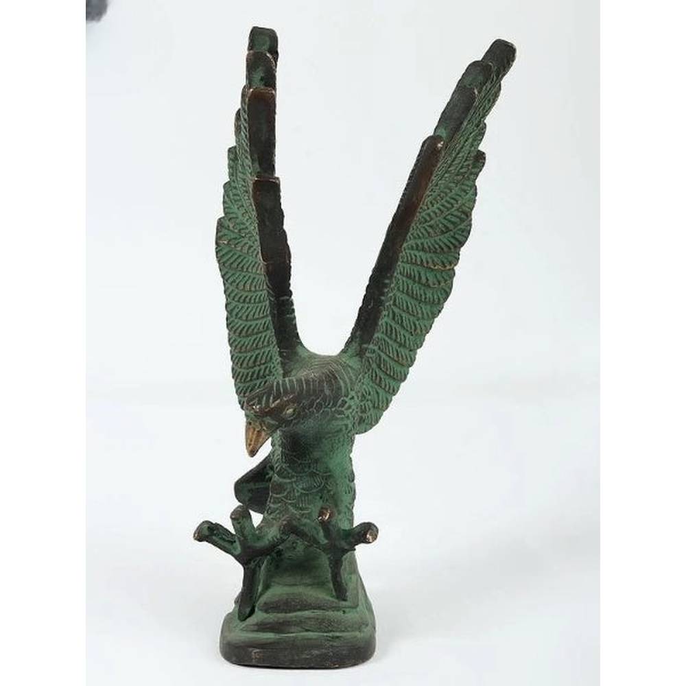 Brass green Patna eagle sculpture, wings spread upward on a dark base, 8 in height