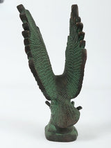Back view of brass green Patna eagle sculpture, wings angled outward with textured feathers