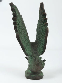 Back view of brass green Patna eagle sculpture, wings angled outward with textured feathers