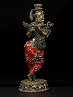 Standing Lord Krishna brass idol with raised hands, green beadwork, red patterned dhoti, round base