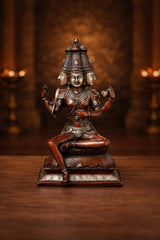 Copper finish seated Brahma sculpture with four arms, detailed headdress, 16 in
