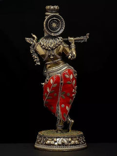 Side view of Lord Krishna brass idol with circular halo, red patterned dhoti, detailed round pedestal
