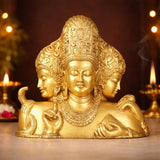 Golden brass Trimurti bust with three faces, ornate headdress and raised palms