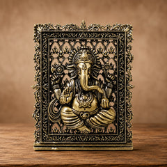 Brass Ganesh panel with ornate filigree frame, embossed deity relief
