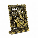 Brass Ganesh panel, angled view with detailed embossed deity and crown