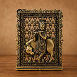 Brass Krishna and cow ornament with detailed frame, front view
