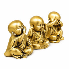 Golden brass seated monks sculpture, side angle with bowed heads and folded hands