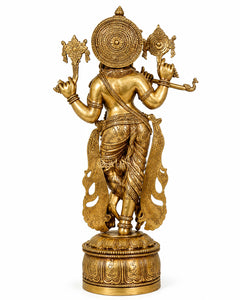 Brass Krishna sculpture from back/side, holding shankh and chakra, detailed waist ornaments