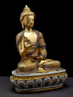Brass Buddha idol seated, palm raised, colorful gemstone trim, ornate lotus base, 16"