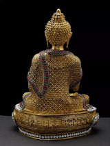 Brass Buddha idol back view, embossed lotus base, multicolor inlay, seated robe, 16"