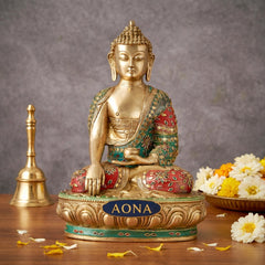Brass Gautam Buddha statue seated in bhumisparsha mudra, multicolor jeweled robe
