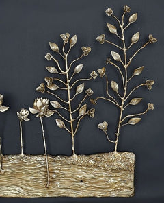 Brass tree branches with small leaf and flower details rising from a textured base