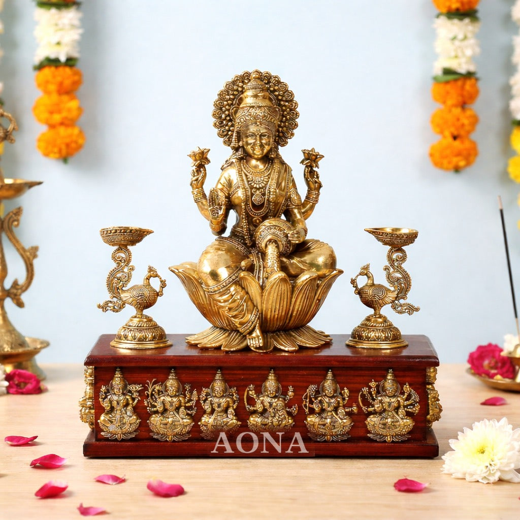 Lakshmi brass goddess idol on wooden base with peacock oil lamps and Ashtalakshmi figures
