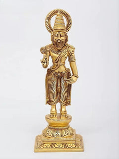 Brass Dashavatara sculpture with long tilak, halo behind head, and hands holding small symbols.