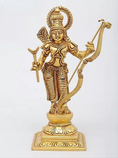Brass Dashavatara figure holding bow-like curved weapon, halo, and detailed patterned garments.
