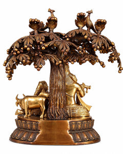 Brass Radha Krishna tree wall hanging with seated figures, cows, birds, and ornate base