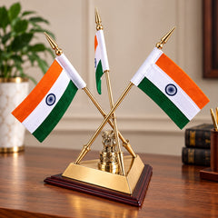 Brass triple flag stand holding three Indian flags on dark wooden base