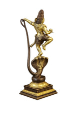 Side view of handcrafted brass Krishna dance figurine on Sheshnag serpent stand