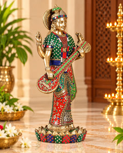 Saraswati brass standing statue, long earrings and crown, green and red patterned attire