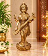 Brass Maa Saraswati statue holding veena, standing on ornate base, 24 in