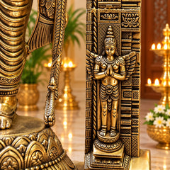 Brass Ram Lalla idol close-up showing side panel figures and hands