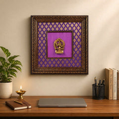Ganesha brass wall hanging in wooden frame, purple patterned backing