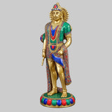 Standing Hanuman brass statue with blue sash, green tunic, and beaded garland.