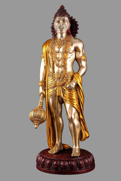 Muscular Hanuman brass statue with gold robe, red crown, and round dark red base