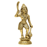 Brass Karuppaswamy statue with staff held aloft and detailed jewelry, full body
