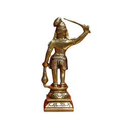 Karuppaswamy brass sculpture rear view, arms raised with staff; hanging ornaments at waist