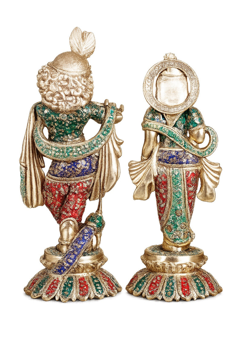 Brass Radha-Krishna sculpture back view, meenakari robes and ornate headpieces, round base