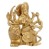 Brass Durga idol statue, close-up of seated goddess and lion base, ornate halo