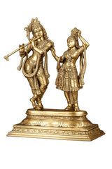 AONA brass Radha Krishna statue, standing couple with arms raised, ornate base