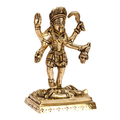 Gold-finish Mahakali idol from side view with raised arms and seated Shiva on base