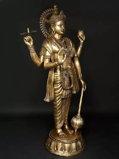 Brass Lord Vishnu idol, side view with four raised hands and draped lower garments