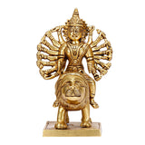 Front view of brass Durga idol seated on lion, fan-like halo back, detailed face