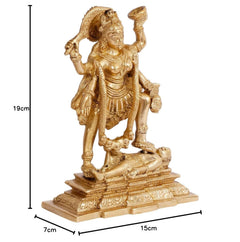 Gold-toned Kali idol figurine standing in a devotional pose on carved base