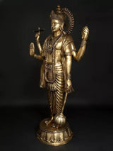 Brass Lord Vishnu idol, front three-quarter view with crown, necklaces, and belt
