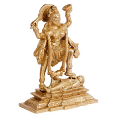 Gold-toned Kali idol figurine, angled view with draped ornaments and carved pedestal