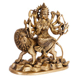 Brass Durga goddess statue seated on lion, detailed draped garment and weapon accessories