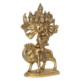 Brass goddess statue on lion base, side view of multi-faced Durga with ornate crown