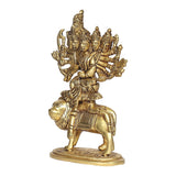 Brass idol riding lion, front 3/4 view of multi-faced goddess with detailed ornaments