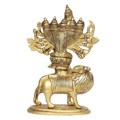 Brass Durga idol on lion, back view with fan-like hand arrangement and patterned garments